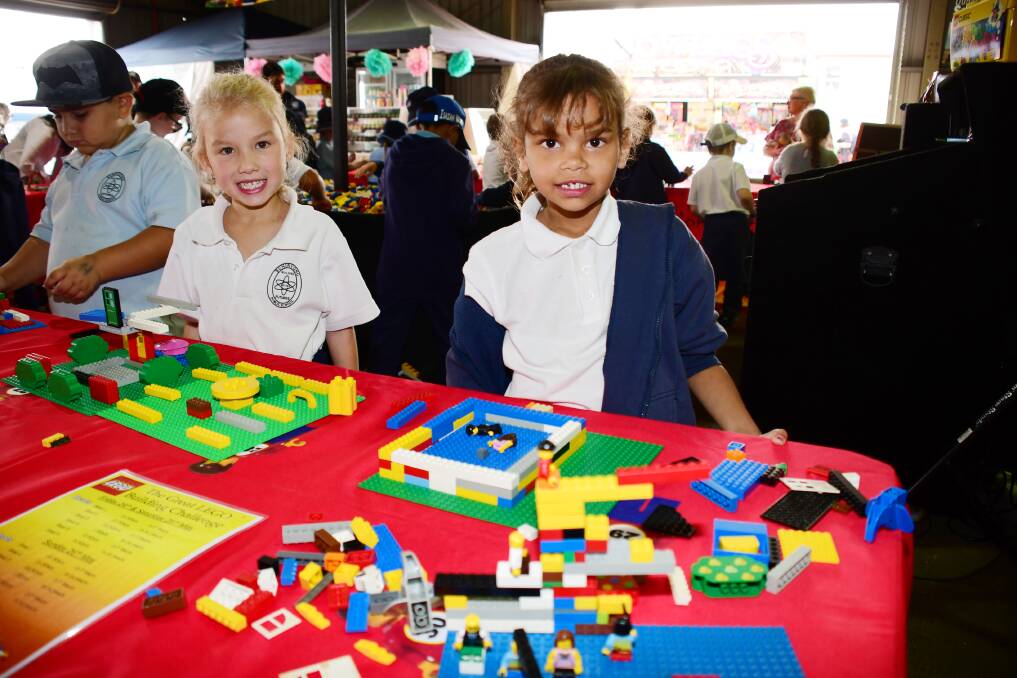 SHOWTIME: Darcie Kellehear-Smith and Chantelle Trapman enjoy competing in the free Great Lego Building Challenge at the 146th Regional Australia Bank Dubbo Show. Photo: AMY MCINTYRE