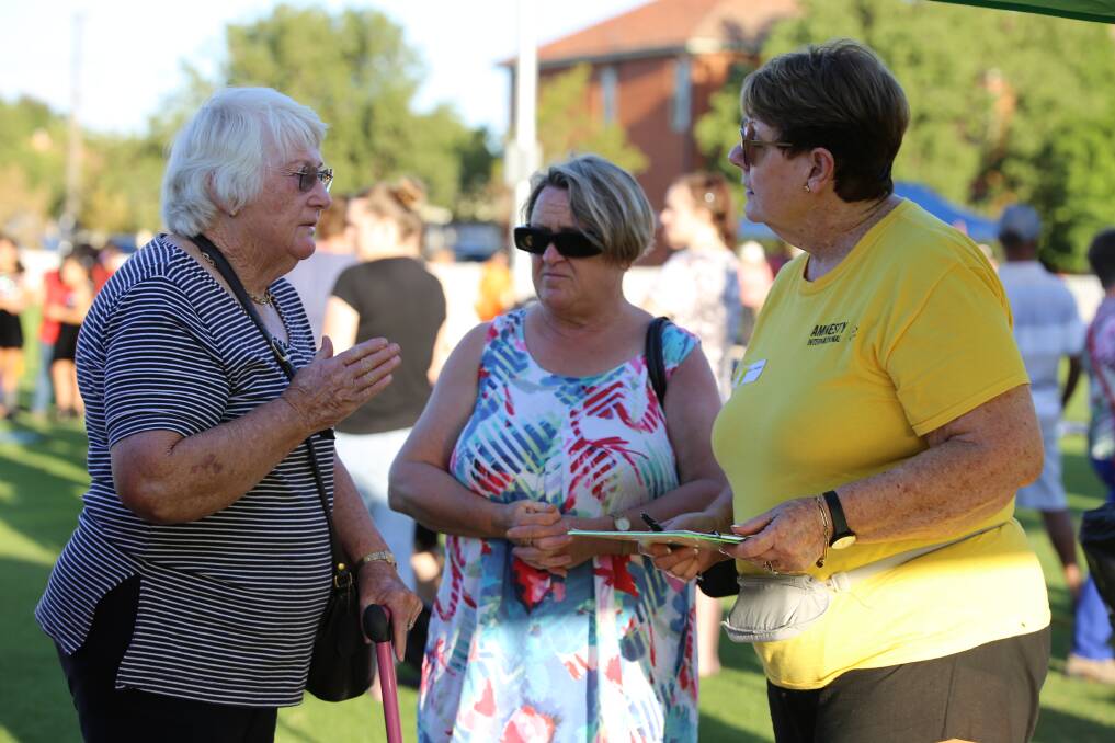 HUMAN RIGHTS:  Barb O'Brien and Fran Schubert talk with Dubbo Amnesty's Sandy Lindeman at the Cross Cultural Carnival. Photo: Contributed