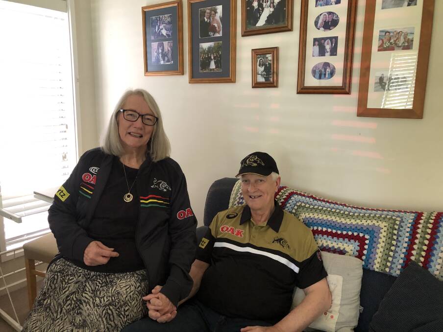 PANTHERS: Dubbo residents Kier and Pat Yeo have their Penrith Panthers outfits ready for the NRL grand final on Sunday night. Photo: KIM BARTLEY.