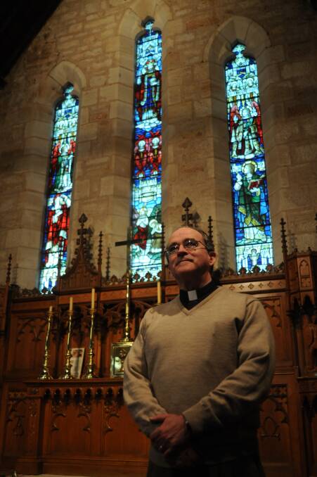 REST IN PEACE: Reverend Craig Moody is pictured in Dubbo's Holy Trinity Anglican Church in the lead-up to Christmas 2012. Photo: File