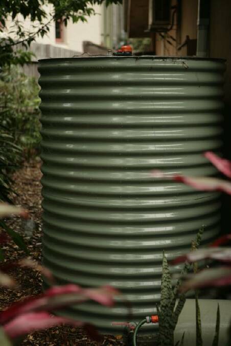 TEST: Dubbo resident Karen Cole says the contents of rainwater tanks could easily be tested for fluoride. Photo: File