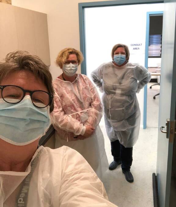 JAB: University of Newcastle's Professor Rhonda Wilson, Professor Amanda Johnson and Associate Professor Donna Hartz don gowns and masks in order to give Indigenous and non-Indigenous people in the Walgett district the COVID-19 jab. Photo: CONTRIBUTED. 