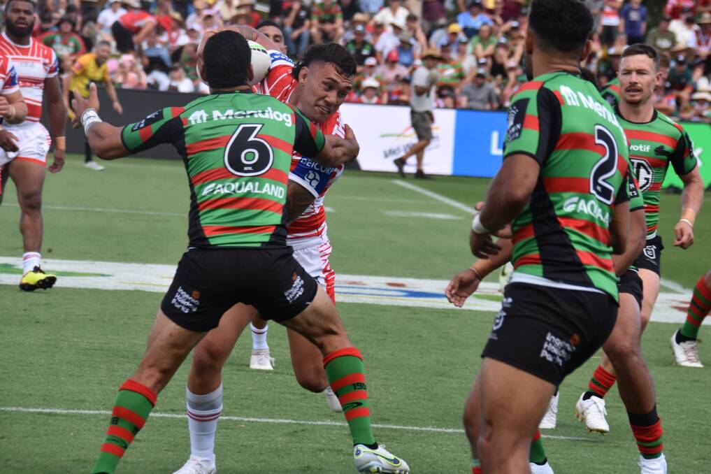 Dragons back-rower Jaydn Su'A tangles with Souths five-eighth Cody Walker in Saturday's Charity Shield. Picture by Harley Bye