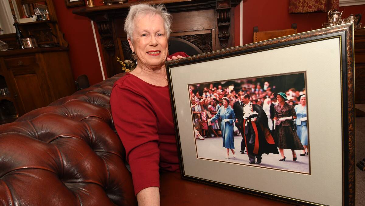 BLAST FROM PAST: Monica Morse with a photo of Queen Elizabeth and former mayor Alan Morse in 1956. Photo :CHRIS SEABROOK