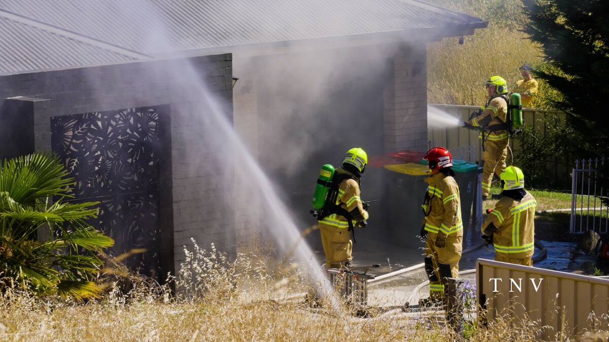 Firefighters at the scene of the blaze on Brooklands Drive. Picture by Troy Pearson/TNV.