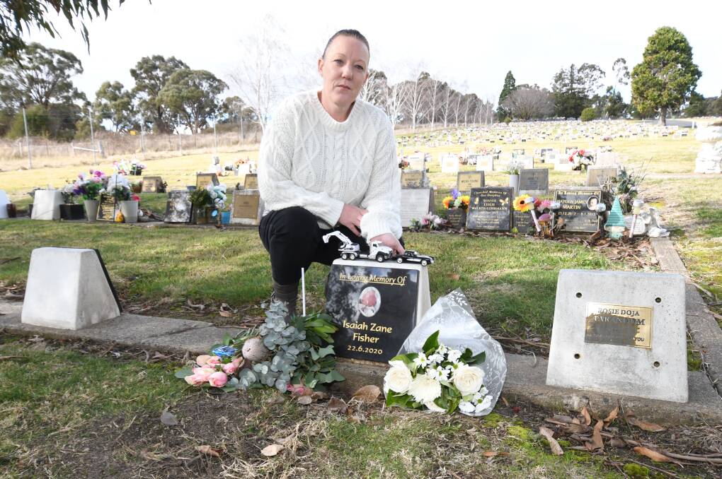 HEARTBREAK: Tammi Fisher at her son's gravesite where items have continually gone missing or been destroyed. Photo: JUDE KEOGH.