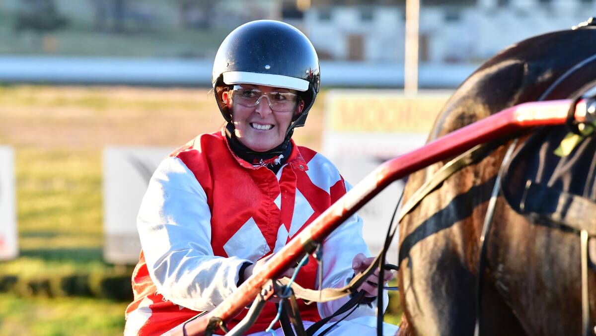 WINNER: Angela Hedges was all smiles after driving Tulhurst Terror to victory. Photo: ALEXANDER GRANT