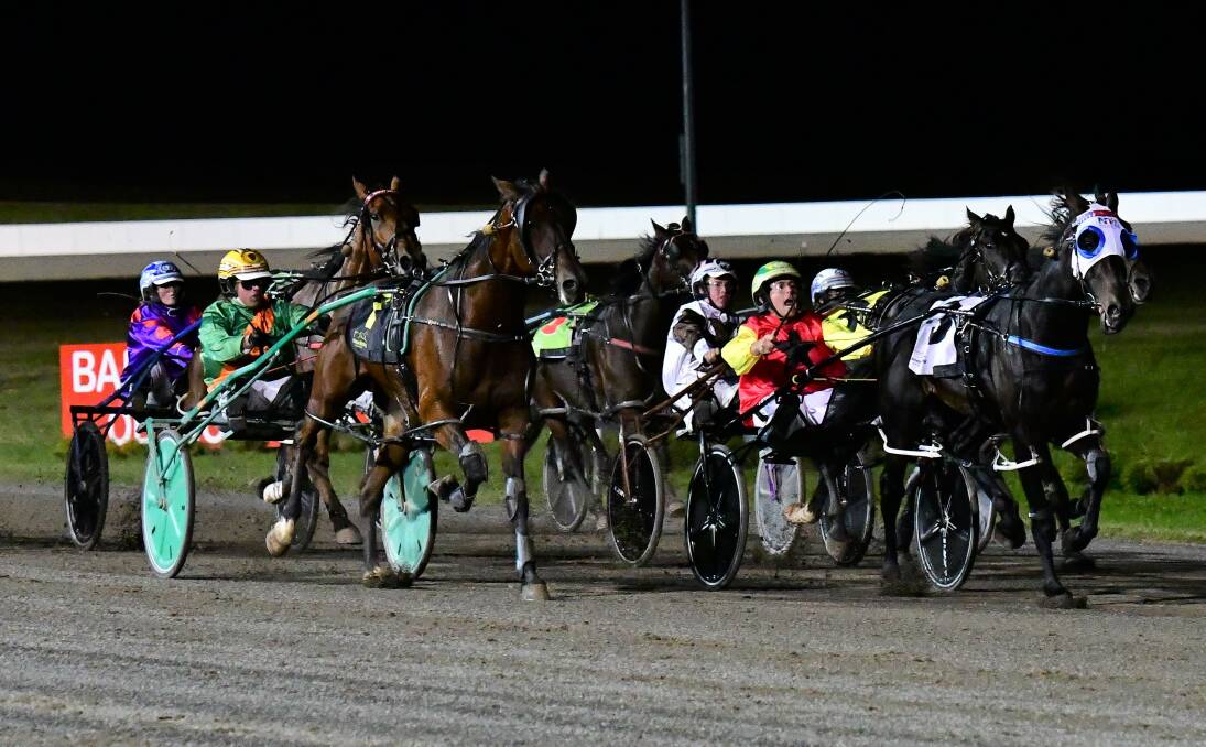 CLOSE FINISH: Nathan Turnbull and Camanchi Warrior (right) won at Bathurst on Wednesday night and on Friday the trainer-driver will be at Dubbo. Photo: ALEXANDER GRANT