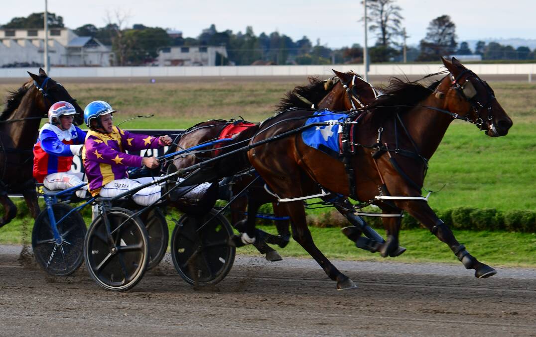 CURSE SNAPPED: Tom Pay drives Renee Dale to victory in Wednesday night's opening race at Bathurst Paceway, fending off a challenge from Just Won More and Amanda Turnbull. Photo: ALEXANDER GRANT