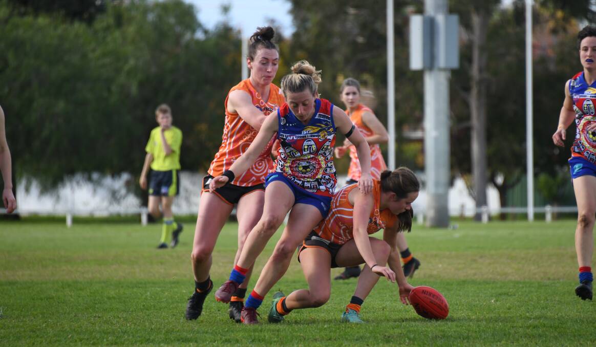 CLASH OF THE TITANS: The AFL Central West women's minor premiership will likely be decided by Saturday clash between the Giants and Demons. Photo: AMY McINTYRE