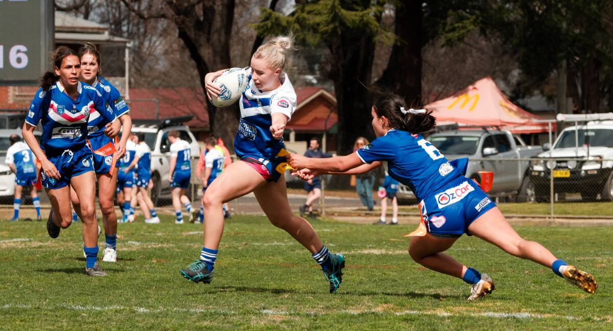Lily Booth tries to find a way through the Raidettes' defence. Picture by James Arrow.