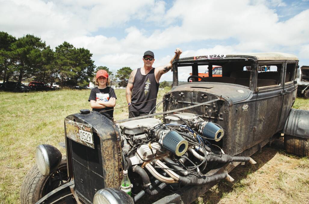Adam Spencer and his son Maximus, with their 1929 V12 rat rod. Picture: Dion Georgopoulos 