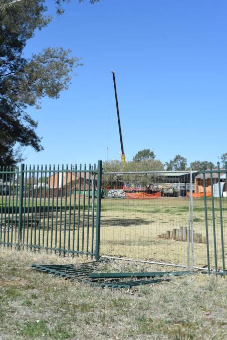 Excavator driven through fence: Police have appealed for the public's help to locate four young people who could help with investigations. Photo: Belinda Soole
