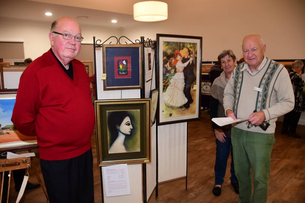 ART SHOW: Roger Hyman, Hela Bryan and Malcom Byan at the first Kintyre Art Show over the weekend. Photo: AMY MCINTYRE