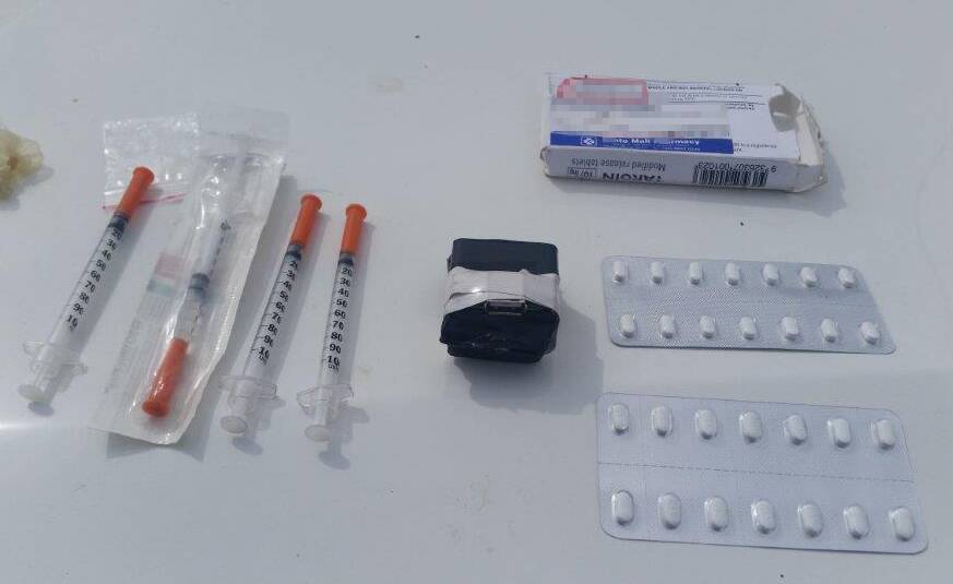 PART OF THE HAUL: The homemade taser, tablets and syringes. Photo: Corrective Services NSW