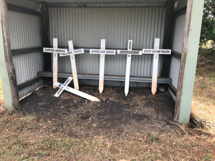 Stolen: The temporary grave markers were found at Firgrove bus shelter by a local resident. Photo: Contributed
