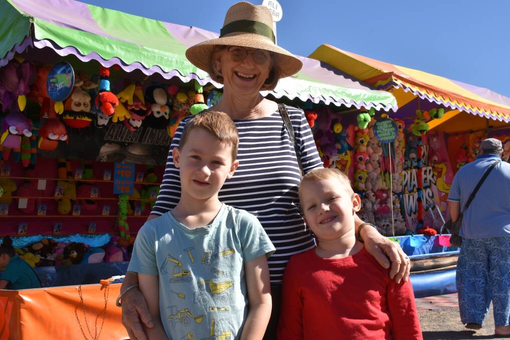 Great time for kids. Helen Officer with grandkids Charlie and Harry at the Moree show. The Showmans' Guild say they are ready to go. Photo by Sophie Harris.