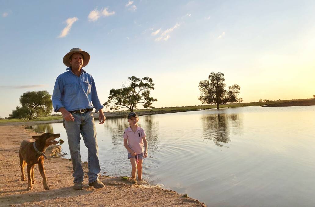 Marcia McMillan took this photo for The Land after Mullengudgery finally received some good rain in March, filling dams and bringing hope. Pictured are her husband Scott and Raphaella, enjoying some rain instead of dust. The Land featured one of her shots on the front page on March 12.
