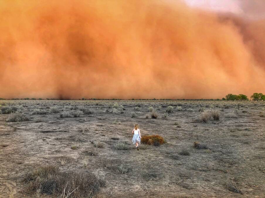 Marcia McMillan's awe-inspiring photo of her daughter Raphaella running into a duststorm at Mullengudgery near Nyngan. The photo she first sent to The Land has now won the Head On international landscape photo award. The McMillans manage Mullengudgery Merino Stud for the Moxham family.