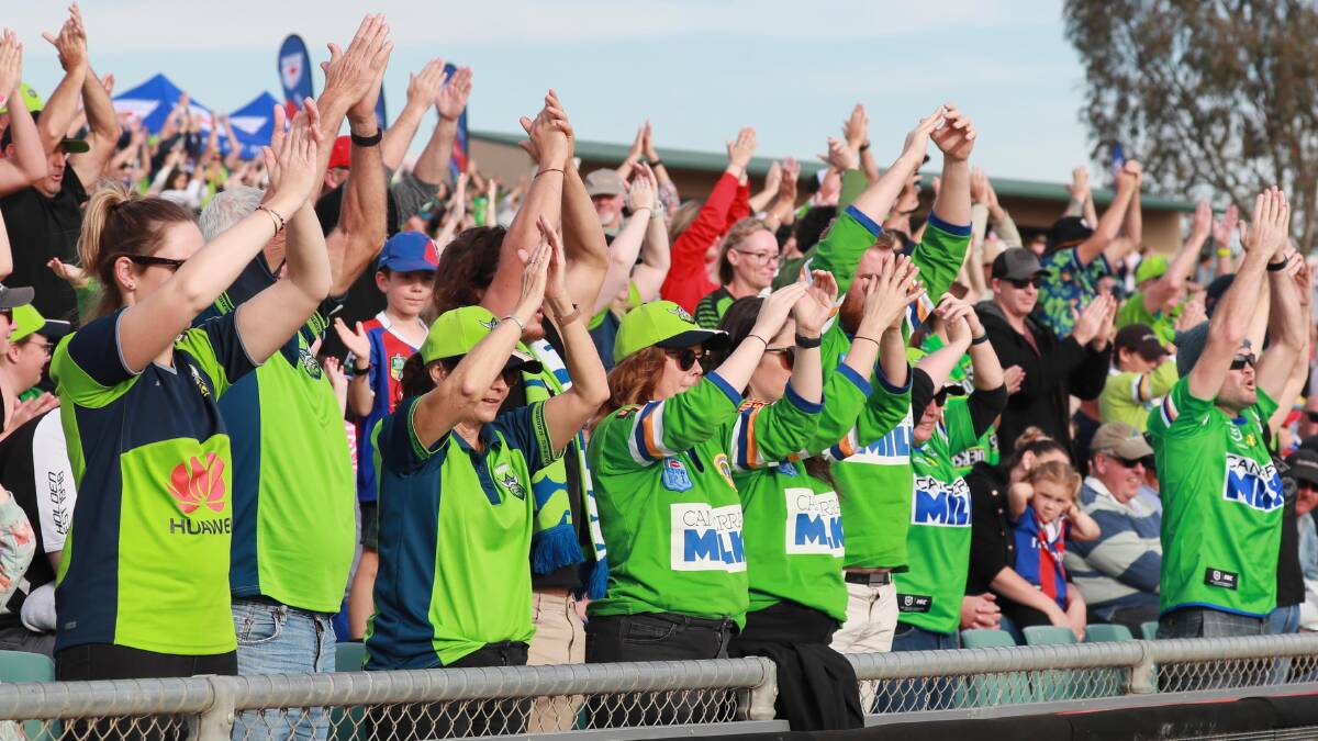 GREEN MACHINE: Raiders fans taking part in the famed Viking Clap at Wagga during the 2021 season. Picture: Les Smith
