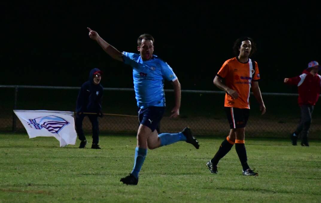 THE HIGHLIGHT: Brad Matiuscenko celebrates after scoring the leveller for Macquarie United in Saturday's WPL grand final. Photo: NICK GUTHRIE