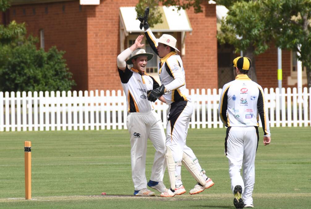 GOT HIM: Ben Patterson (left) celebrates a wicket with Dan French during Newtown's hard-fought win over the previously unbeaten RSL-Colts. Photo: AMY McINTYRE