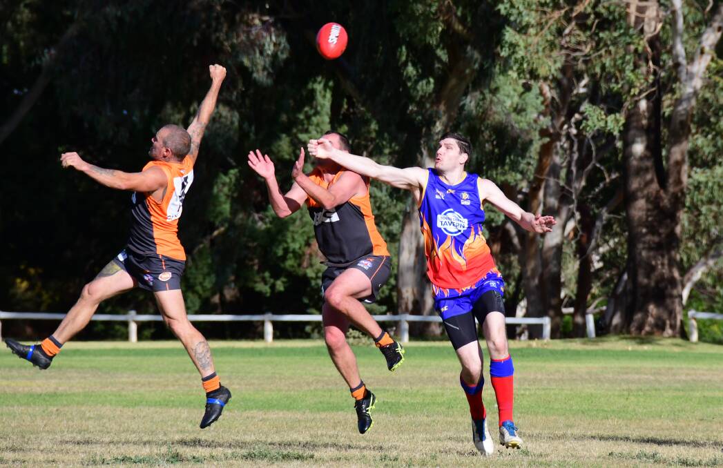 WORKING: Joah Anasis (right) of the Demons battles the Bathurst Giants for the ball last season. The two clubs are both working to fill two grades for 2020. Photo: AMY McINTYRE