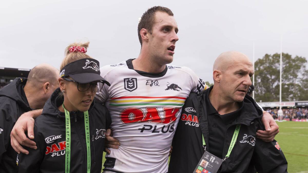 WORRIES: A groggy Isaah Yeo is assisted from the field after being hit high last weekend. Photo: AAP/CRAIG GOLDING