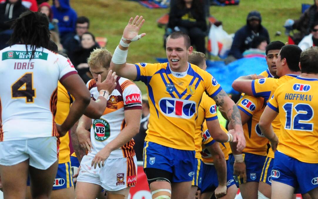 WORTH CELEBRATING: David Klemmer in action during the City-Country match at Apex Oval in 2014, the last top-flight match in the city. Photo: BELINDA SOOLE