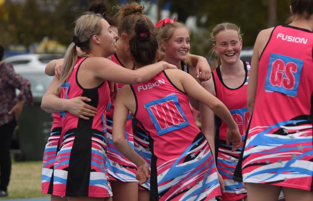 GOING AGAIN: Fusion Heat players celebrate winning last year's A Grade grand final. The premiers will take on some new faces in this year's competition. Photo: AMY McINTYRE