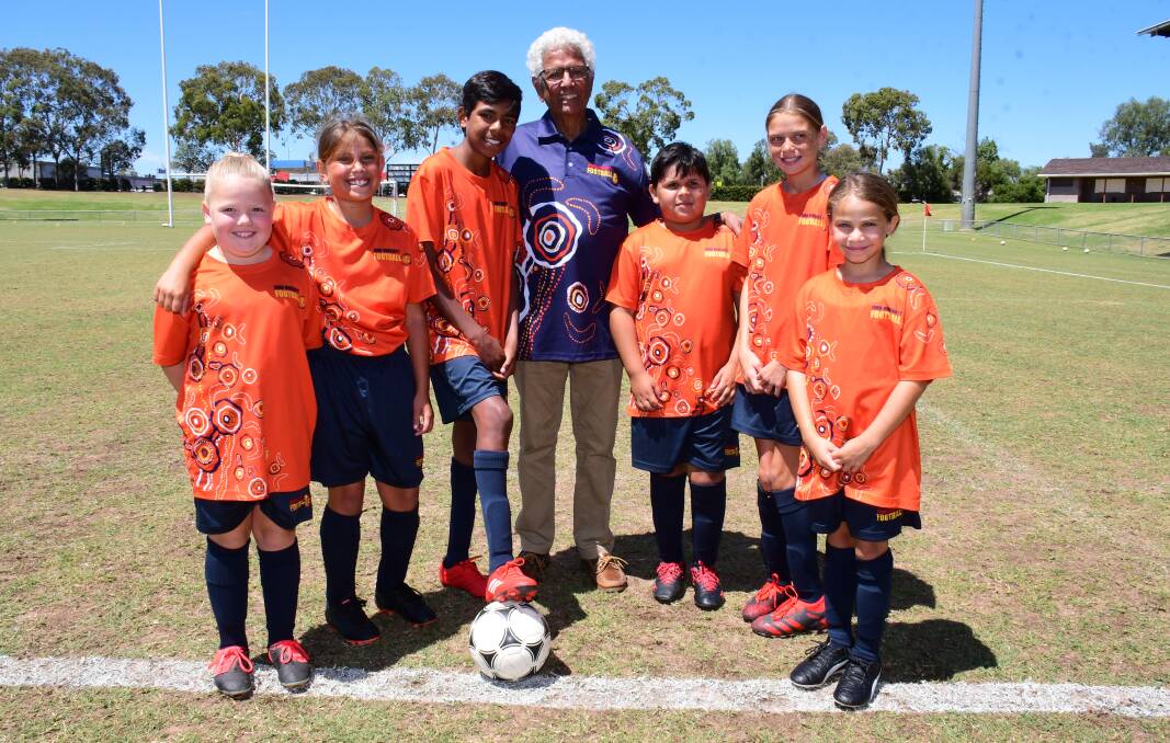 MAKING A DIFFERENCE: John Moriarty (centre) was one of a number of high-profile football identities in Dubbo in November. Photo: BELINDA SOOLE