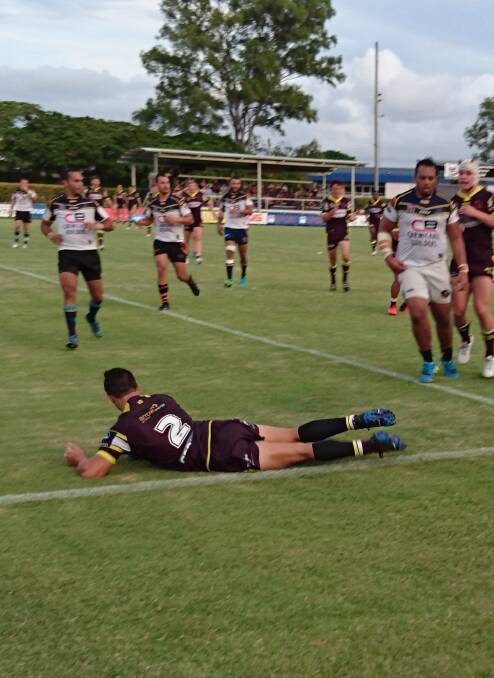 HE'S OVER: Kotoni Staggs crosses to score Brisbane's first try on the weekend.
