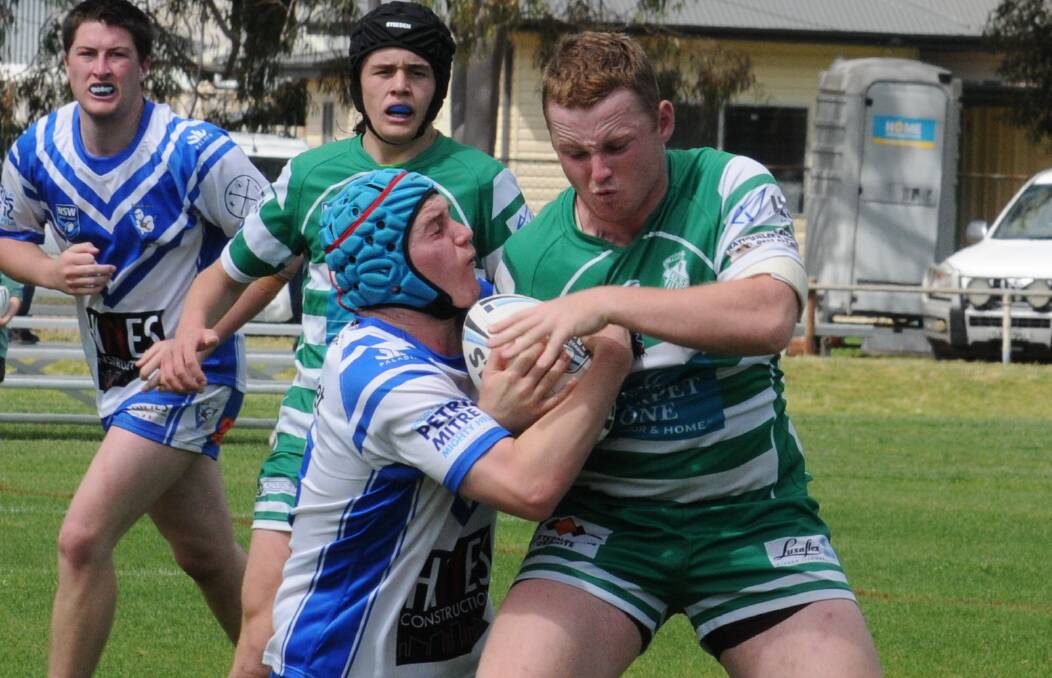 REUNITED: Charlie Hollman of CYMS crashes into the St Pat's defence during last season's Western Youth League. The two teams meet again on Saturday. Photo: NICK GUTHRIE