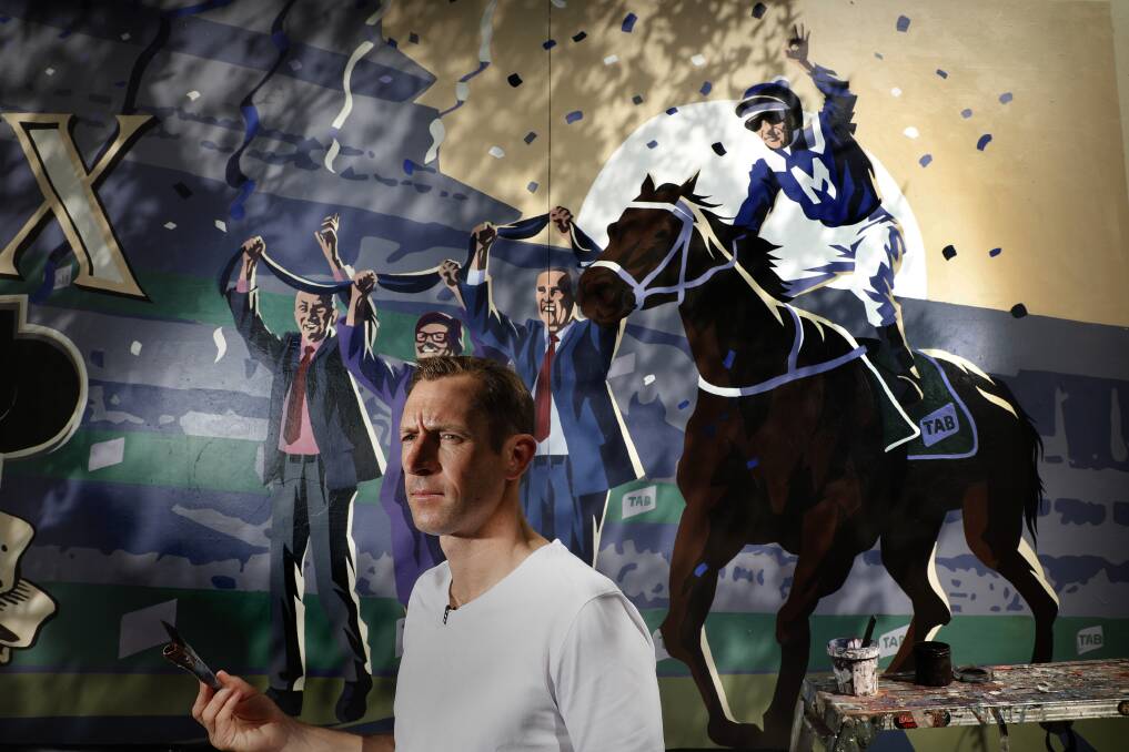 SPECIAL: Hugh Bowman with a mural portraying he and Winx earlier this week. Photo: AAP