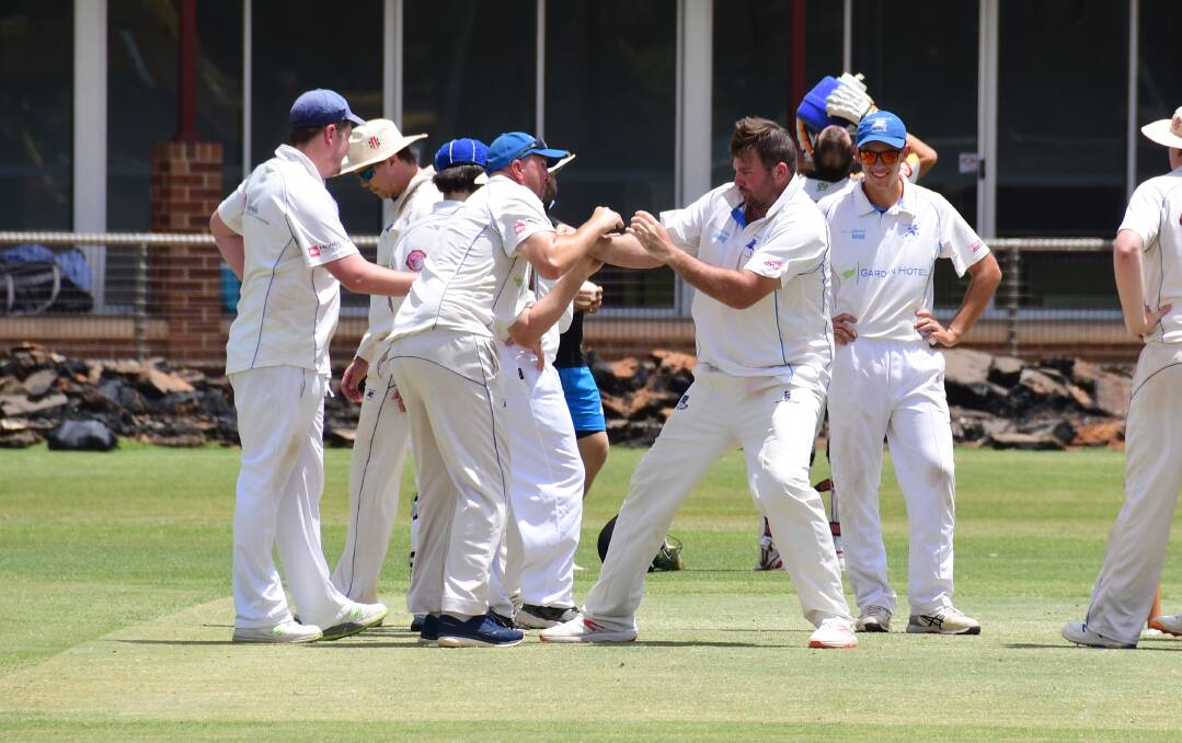 HAVING A BALL: Jason Green (left) and Ben Strachan have some fun following a wicket for Macquarie last weekend. They'll be hoping for more reason to celebrate against CYMS this weekend. Photo: CONTRIBUTED