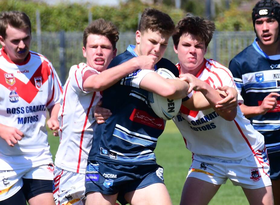 BATTLE: Macquarie's Aston Warwick in action against Group 10 side Mudgee in the recent Western Youth League. Photo: SIMONE KURTZ