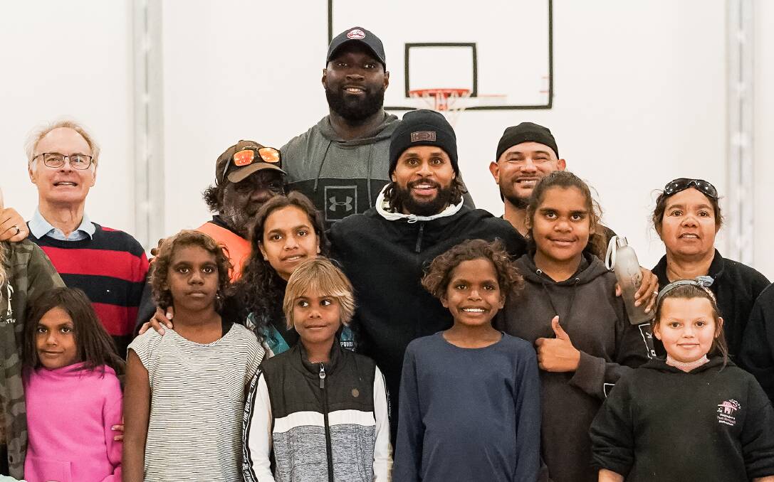 WORK: Patty Mills (centre) wants to make a difference for Aboriginal and Torres Strait Islander Youths. Photo: CONTRIBUTED