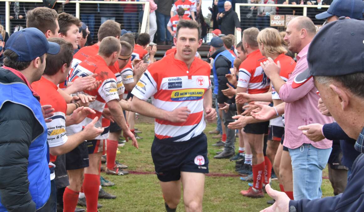 CHAMPIONS: Bill Cummins leads out the Eagles for their final game of the season, a 23-12 victory over Emus that won them the 2021 premiership. Photo: ANDREW FISHER