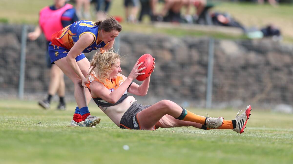 GOT HER: Dubbo's Caroline McGrath rounds up a Giants player during Saturday's grand final clash. Photo: PHIL BLATCH