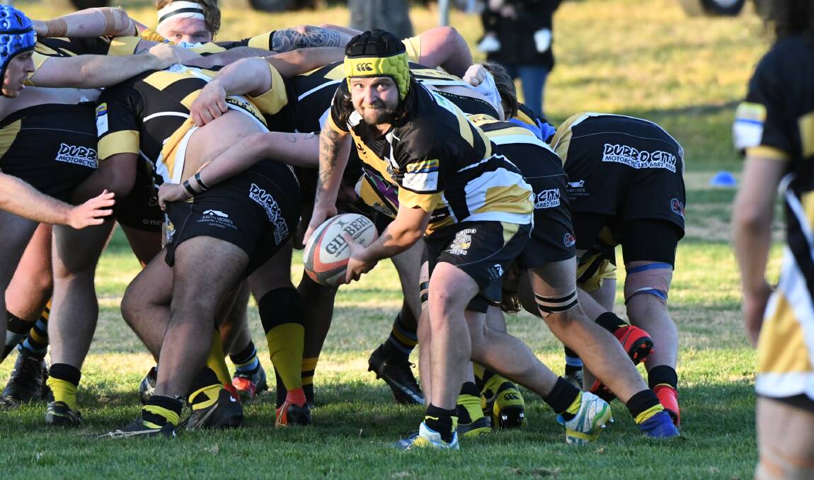 SET IT UP: Scrumhalf Jason Caddies works the ball out in the hope of setting up a Dubbo Rhinos attacking raid during Saturday's clash with CSU Bathurst. Photo: CHRIS SEABROOK