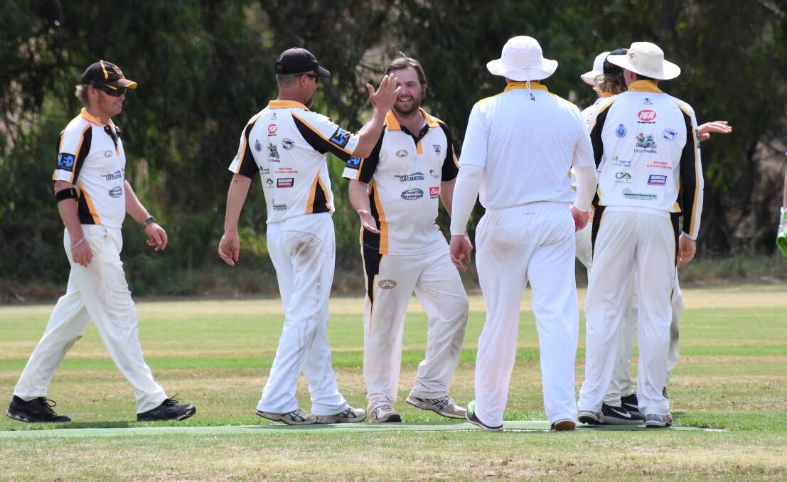ON A ROLL: Newtown celebrates one of four wickets taken by Dale O'Donnell (centre) on Saturday afternoon. Photo: AMY McINTYRE
