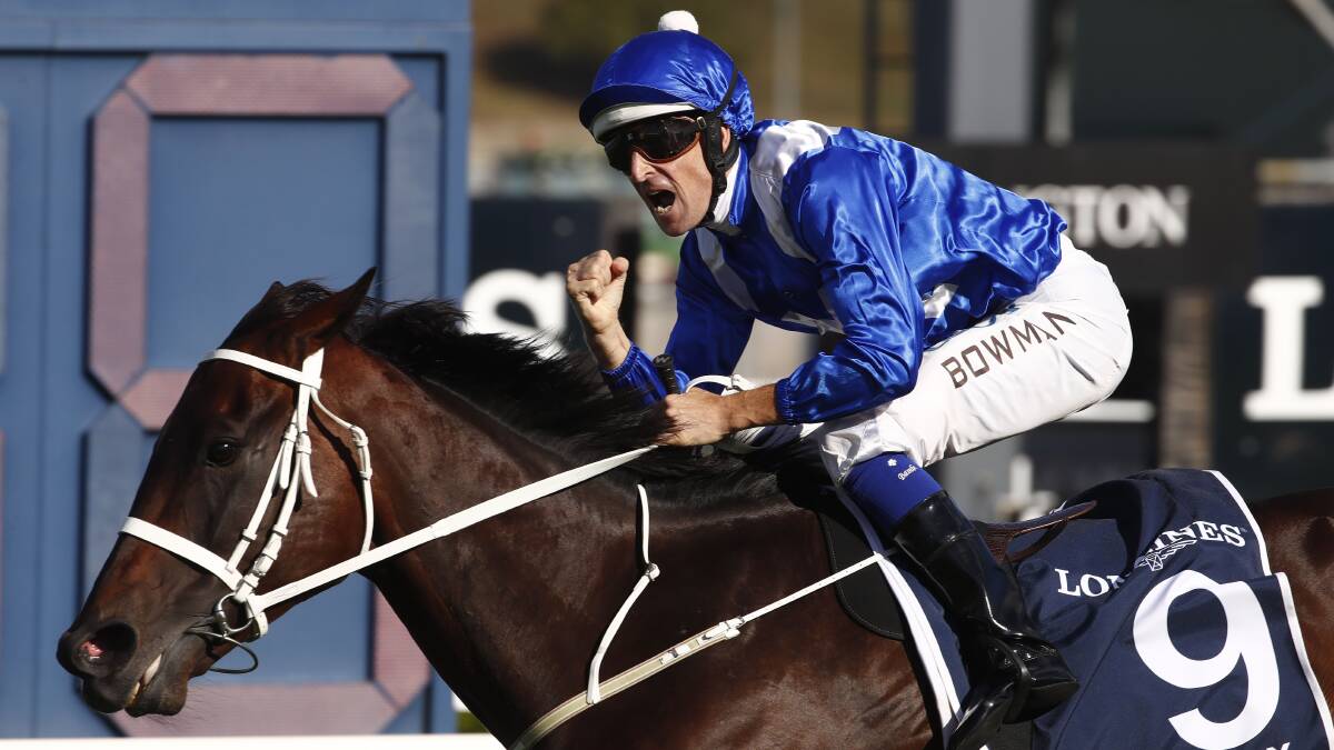 SPECIAL: Hugh Bowman celebrates as he passes the post to win aboard Winx yet again on Saturday. Photo: AAP/DANIEL MUNOZ