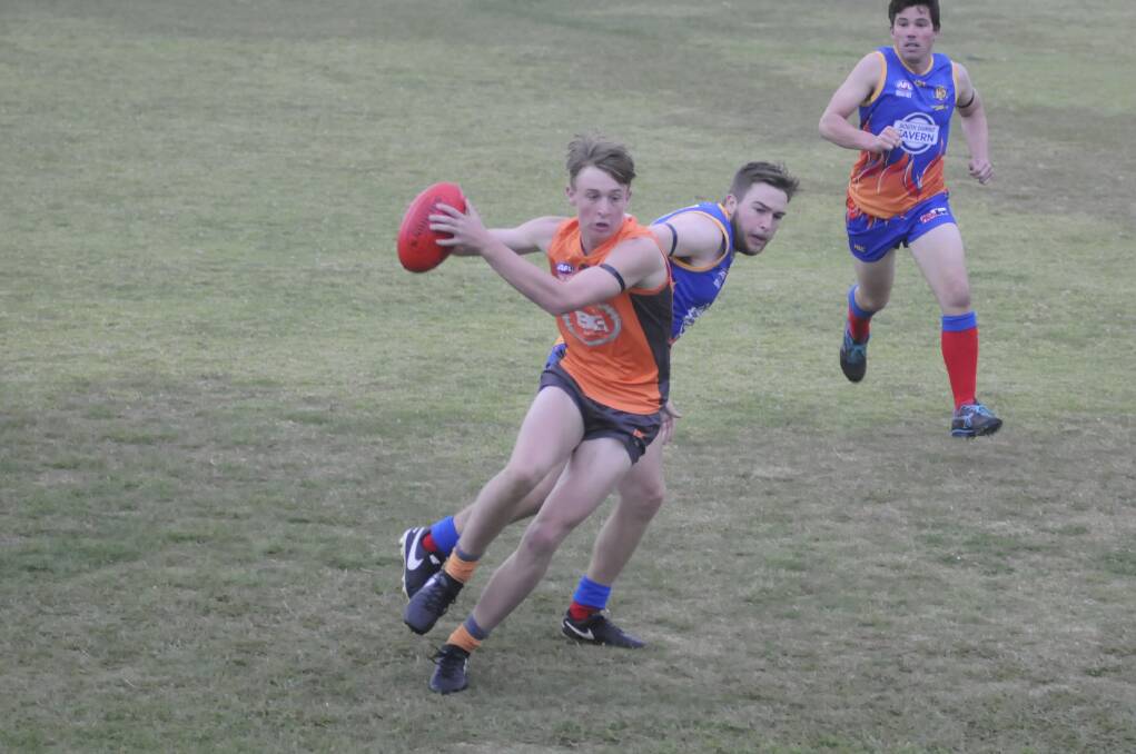 GET HIM: Sam Reichstein, playing his first match for the Demons in 2017, gives chase to Bathurst Giant Mitchell Taylor during Saturday's clash at King George No. 1. Photo: CHRIS SEABROOK