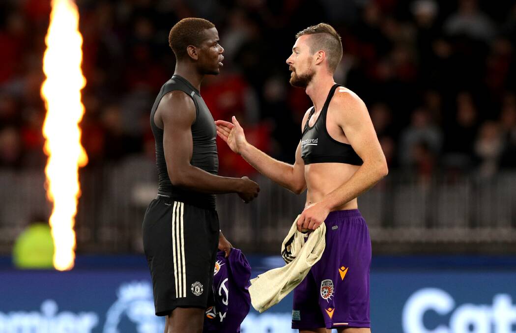 SPECIAL MOMENT: Dubbo junior Jacob Tratt (right) swapped jerseys with French star Paul Pogba after last month's friendly. Photo: AAP