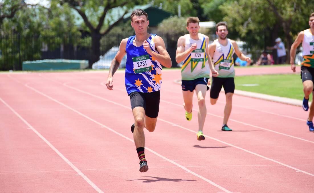 GOT IT: Tyler Gunn cruises towards the line in the open 400m at Barden Park on Sunday. Photo: AMY McINTYRE