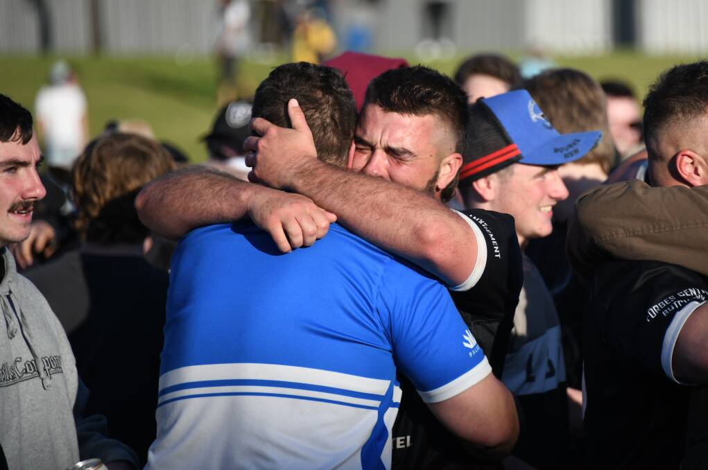 Traie Merritt celebrates with his brother, Zac, after Forbes' title triumph. Picture by Amy McIntyre