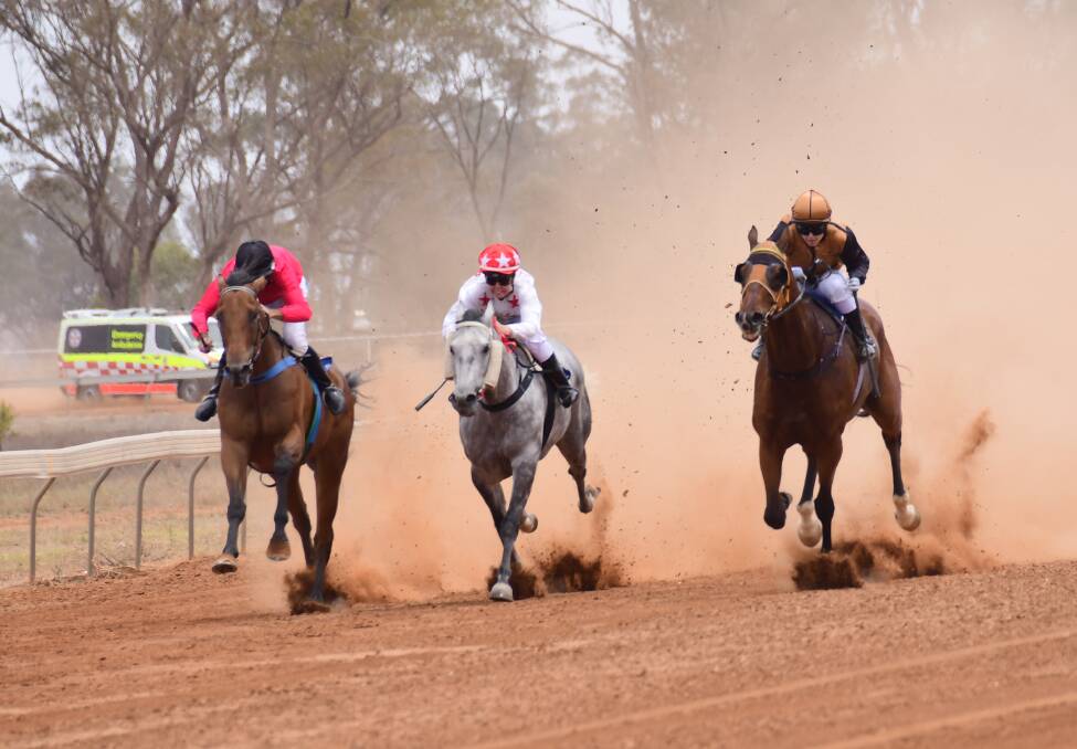 ON THE WAY: Star Express (right) on the way to victory at Trangie last year. Photo: AMY McINTYRE
