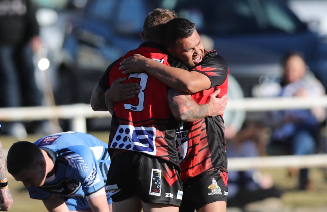CJ Ralph celebrates a try with Jyie Chapman during Group 11's loss to Group 10 at Lithgow last season. Picture: Phil Blatch
