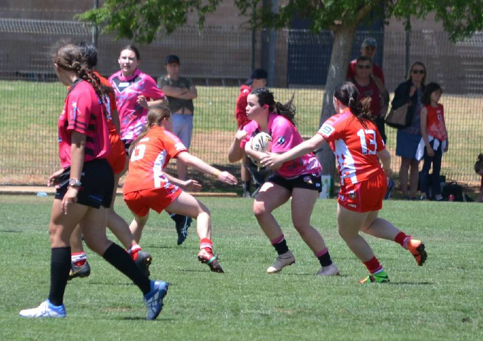 CHARGE: Lilli-Rai Campbell takes on the defence during the weekend's Western Women's Rugby League under 18s action. Photo: GOANNAS WESTERN WOMEN'S RUGBY LEAGUE