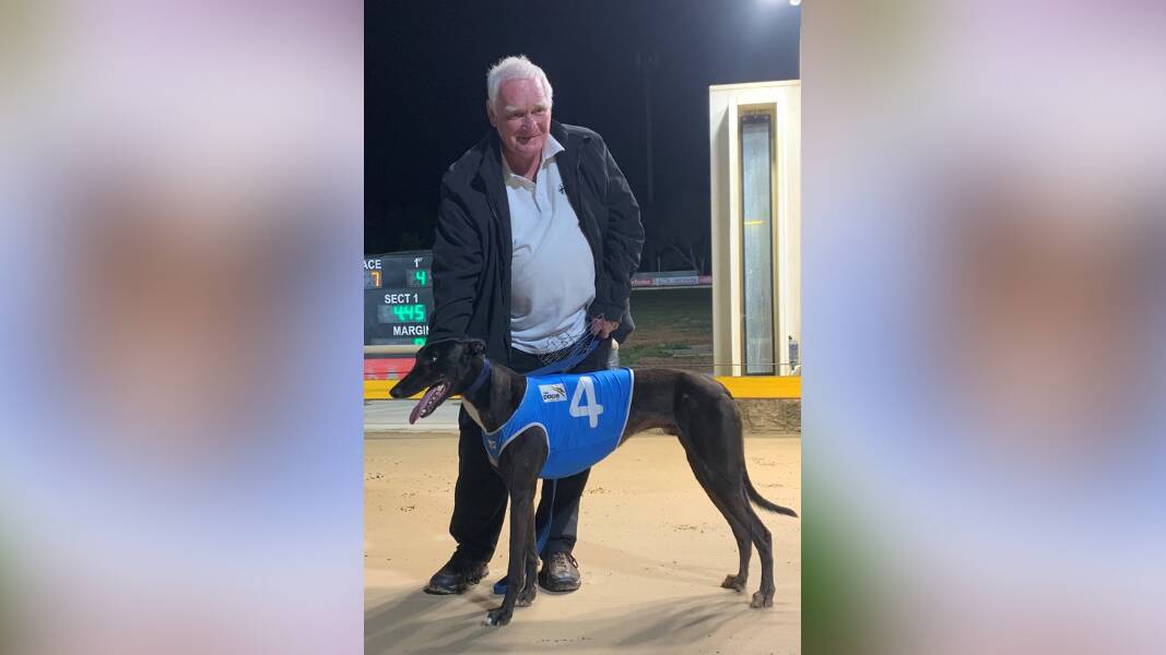STARTING POINT: Ian Gilders with Billy Creek after one of the dog's early wins at Dubbo this year. Picture: Dubbo Greyhounds